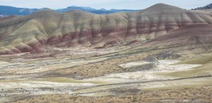 The hills are complicated my the soft colors and the hard desert.